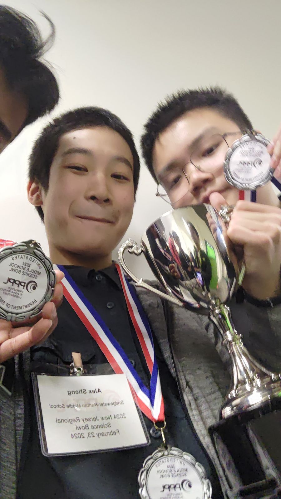 Picture of Alex with the Science Bowl Trophy